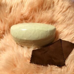 Coach  sunglass case, white in color, comes with cleaning cloth!